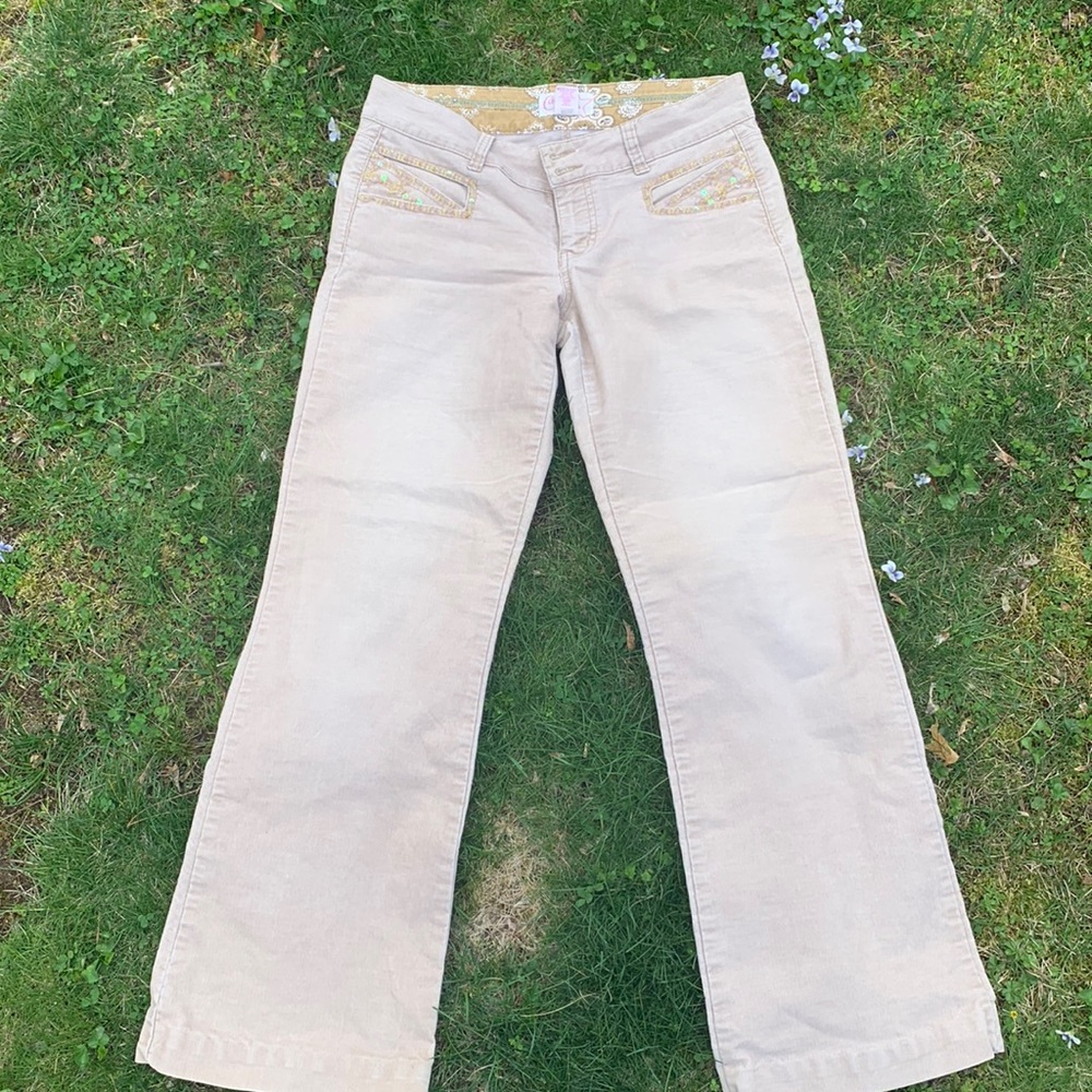 beige/cream colored jeans, low rise, little bit of a flared bottom